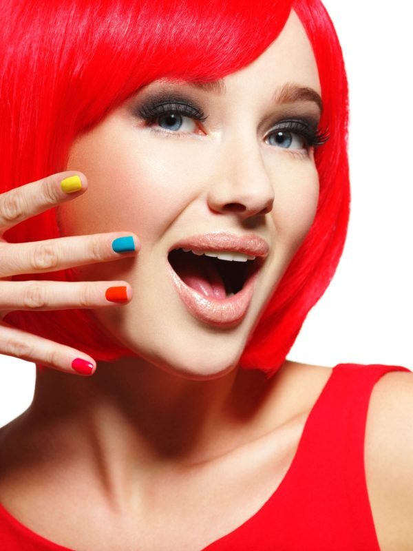 surprised-face-young-pretty-woman-with-bright-red-hairs-multicolor-nails (1) (1)